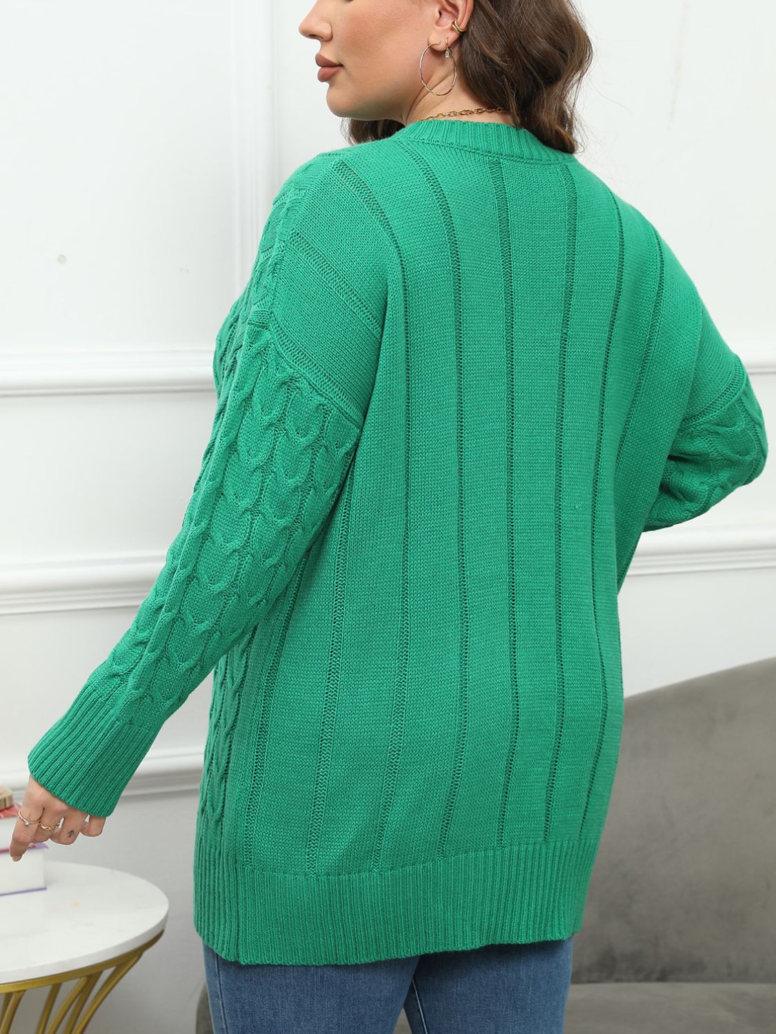 Cable knit diamond stitch sweater in Dark Green acrylic with ribbed cuffs and hem.