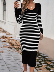 Black and white striped knit midi dress with V-neck and flared sleeves.