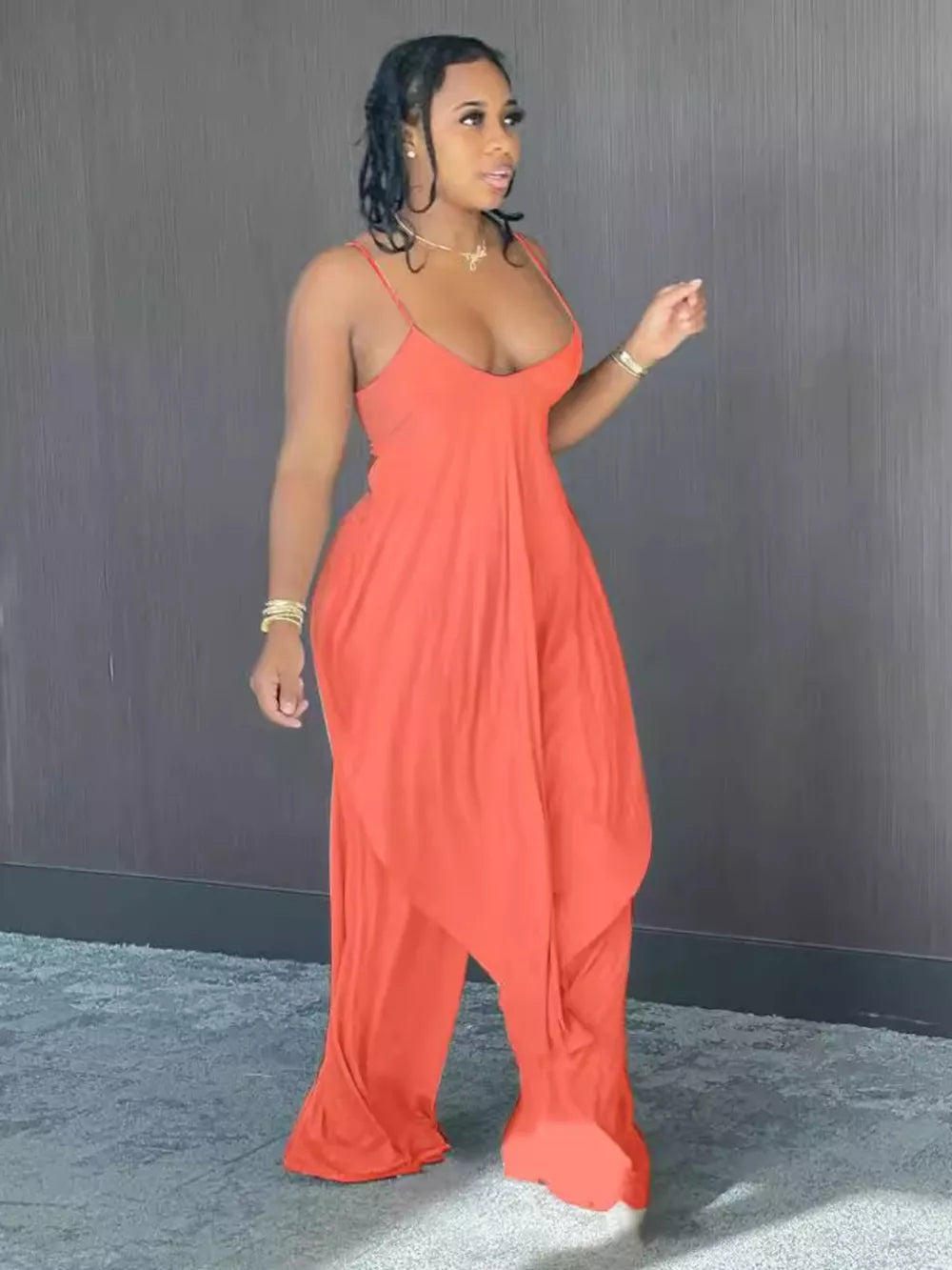 Orange cami and wide-leg pants set with asymmetrical draped hem.