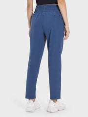 Peacock blue performance trousers with elastic waistband and straight leg