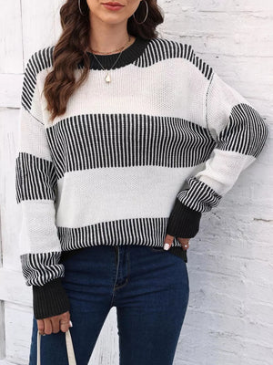 Cozy acrylic color block knit sweater with black and white stripes and crew neck.
