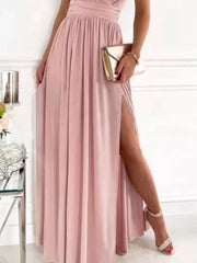 Dusty pink maxi dress with high slit and lace accents, featuring a ruched bodice.