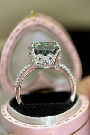 Emerald cut halo engagement ring in sterling silver with pave diamond band.