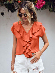 Orange-red flutter sleeve V-neck blouse with cascading ruffles and button detail.