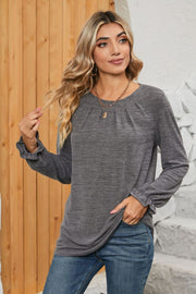 Dark Gray knit top with pleated yoke and ruffled cuffs.