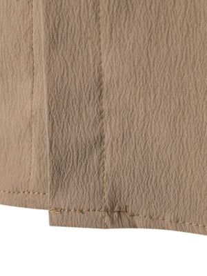 Men's beige cotton button-up shirt with textured fabric detail