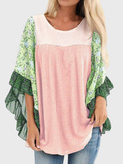 Textured panel blouse in blush pink with floral flutter sleeves and ruffled trim.