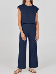 Dark blue seamed knit wide-leg co-ord set with cap sleeves and ribbed detailing.