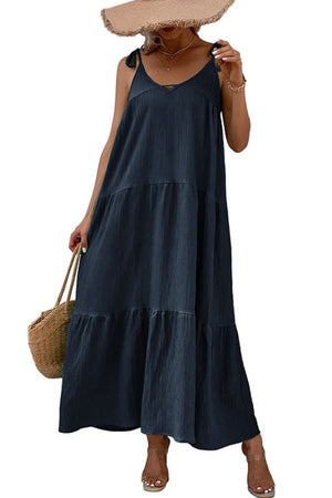 Dark blue tiered maxi dress with tie straps and a V-neckline.