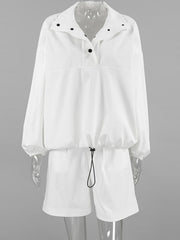 White two-piece set with snap details on collar and drawstring waist.