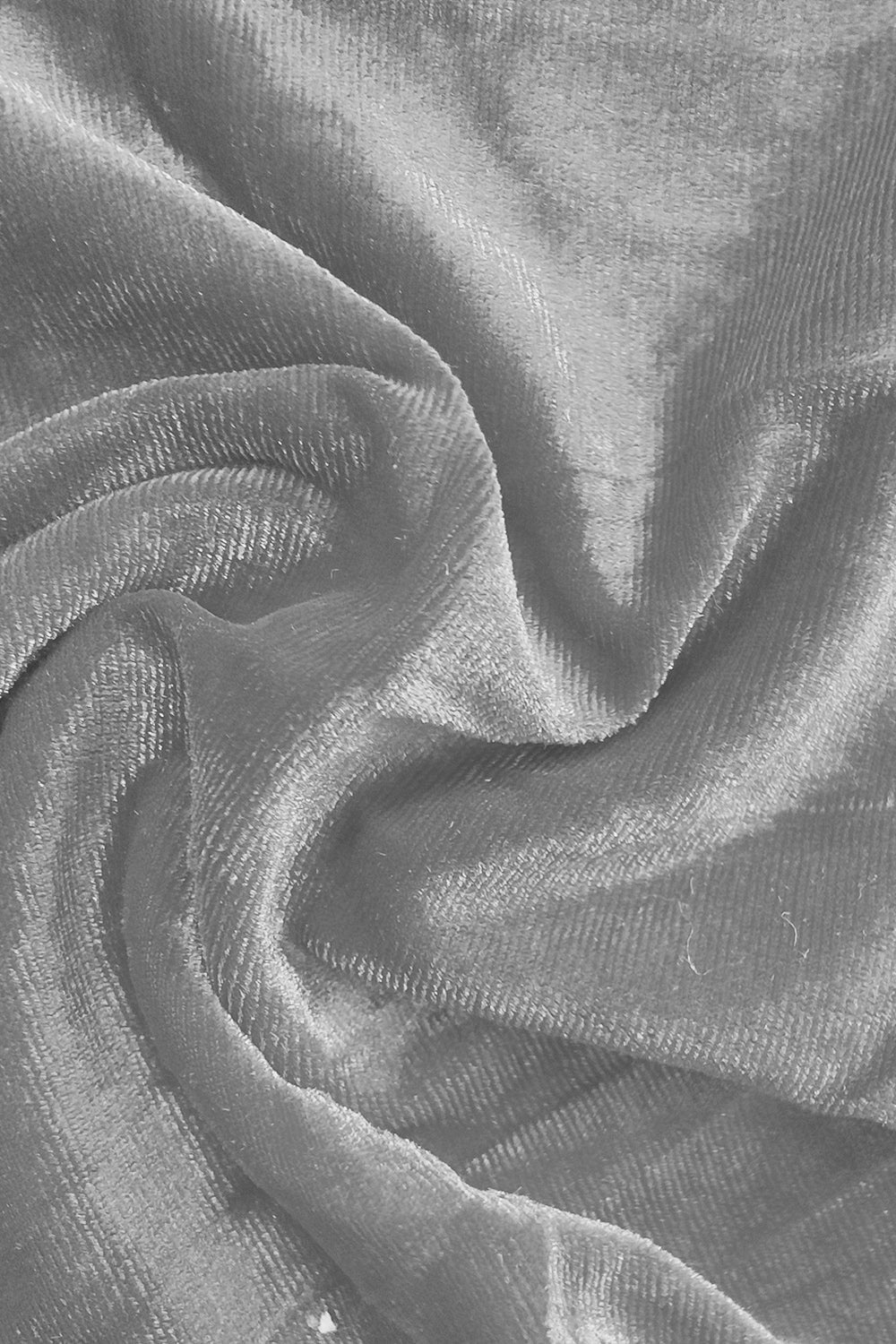 Plush velvet wide-leg trousers in gray, showing fabric texture and drape.