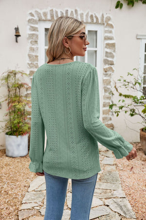 Light Green eyelet lace blouse with ruffle sleeves and a scoop neckline.