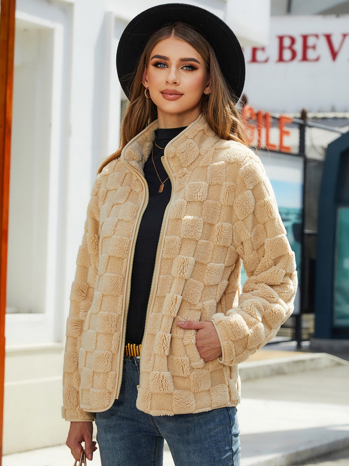 Tan textured grid zip-up jacket with stand-up collar and pockets.