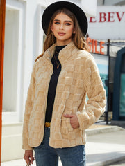 Tan textured grid zip-up jacket with stand-up collar and pockets.