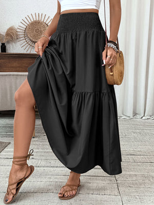 Black ruffled smocked waist maxi skirt with tiered hem detail