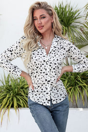 Dalmatian print knot-front shirt in white with black spots, button-up style.