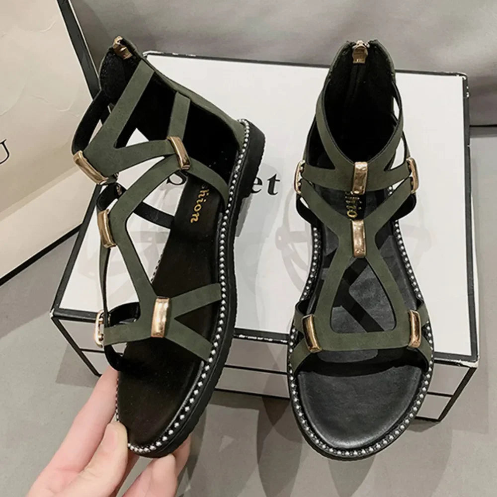 Army green gladiator sandals with gold accents and zip-back closure.