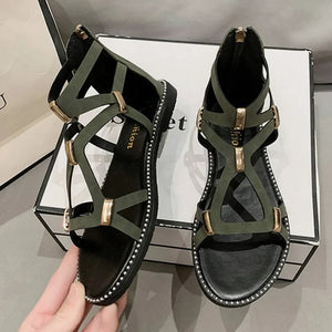 Army green gladiator sandals with gold accents and zip-back closure.