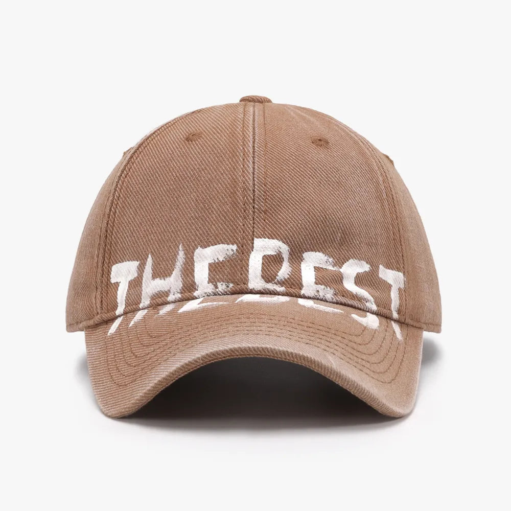 Textured denim baseball cap in coffee brown with white graphic text detail.