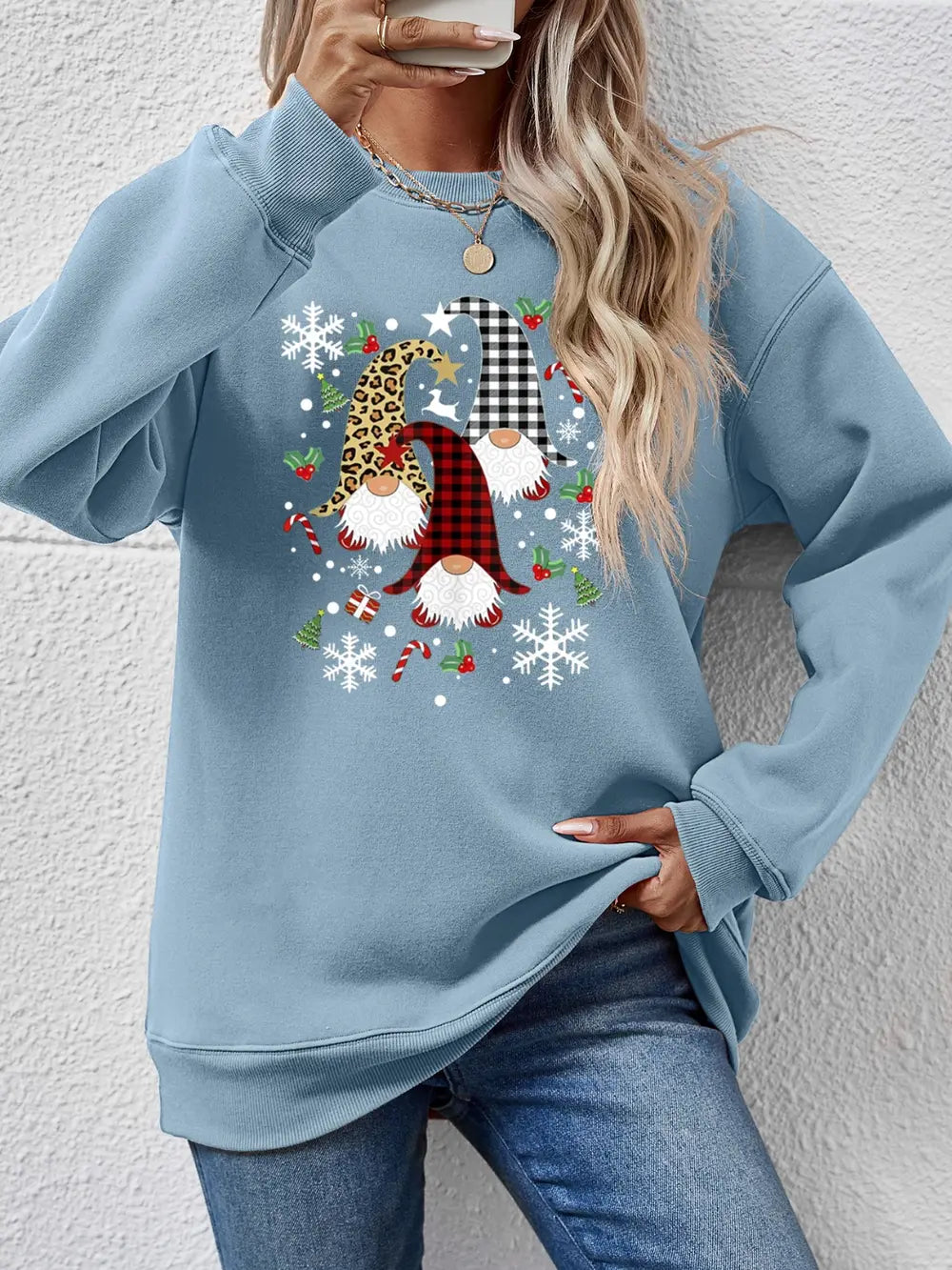 Festive gnome graphic raglan sweatshirt in Misty Blue with holiday patterns and snowflakes.
