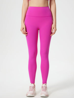 Fuchsia pink high-waisted sculpted contour leggings with pocket detail.