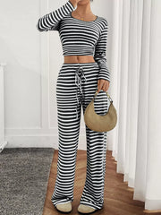 Black and white striped loungewear set with drawstring pants and a cropped long-sleeve top.