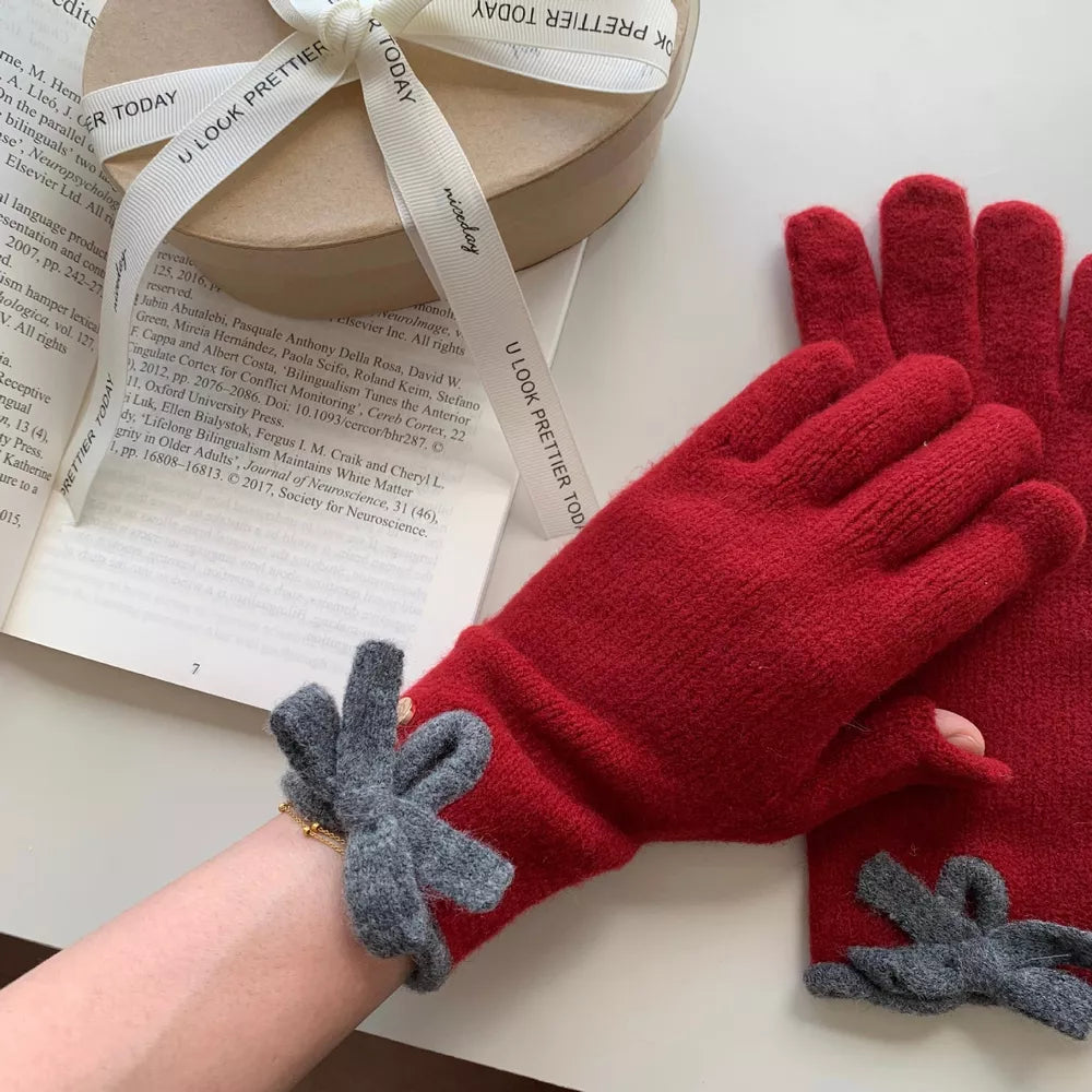 Deep Red knit gloves with gray bow details and a cozy texture.