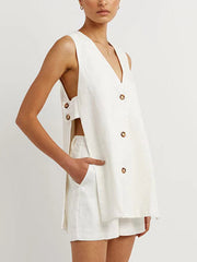 White linen co-ord set with cut-out back and button details.