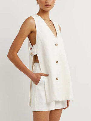 White linen co-ord set with cut-out back and button details.
