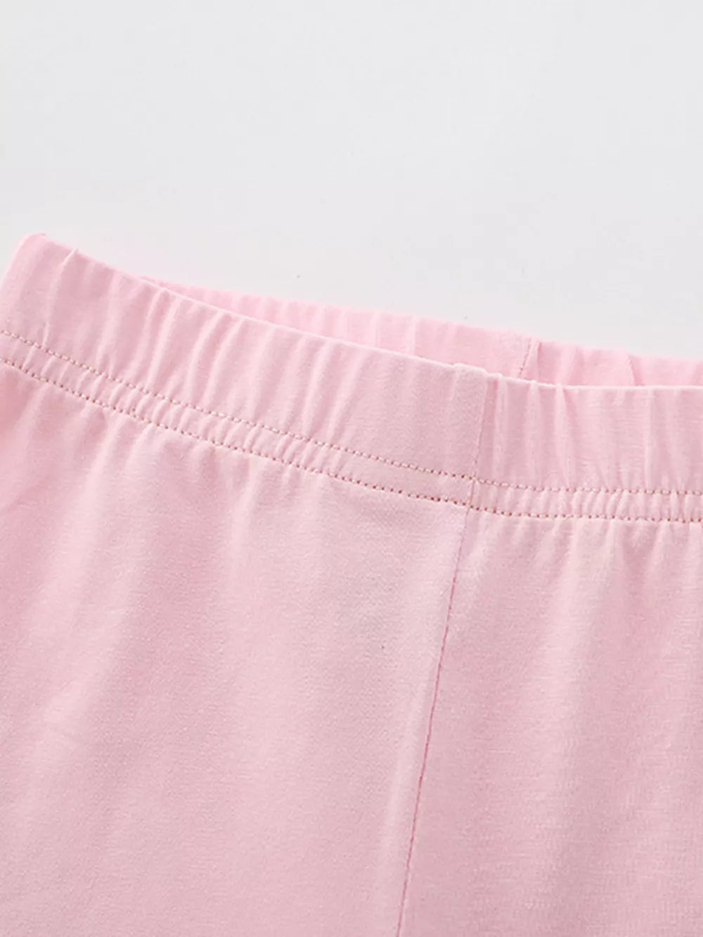Pink cotton toddler leggings with elastic waistband detail