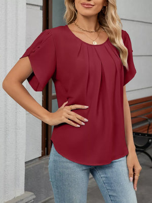 Wine red pleated short sleeve polyester blouse with round neckline.