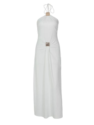 White halter neck ruched maxi dress with ornate square embellishments at the neckline and waist.