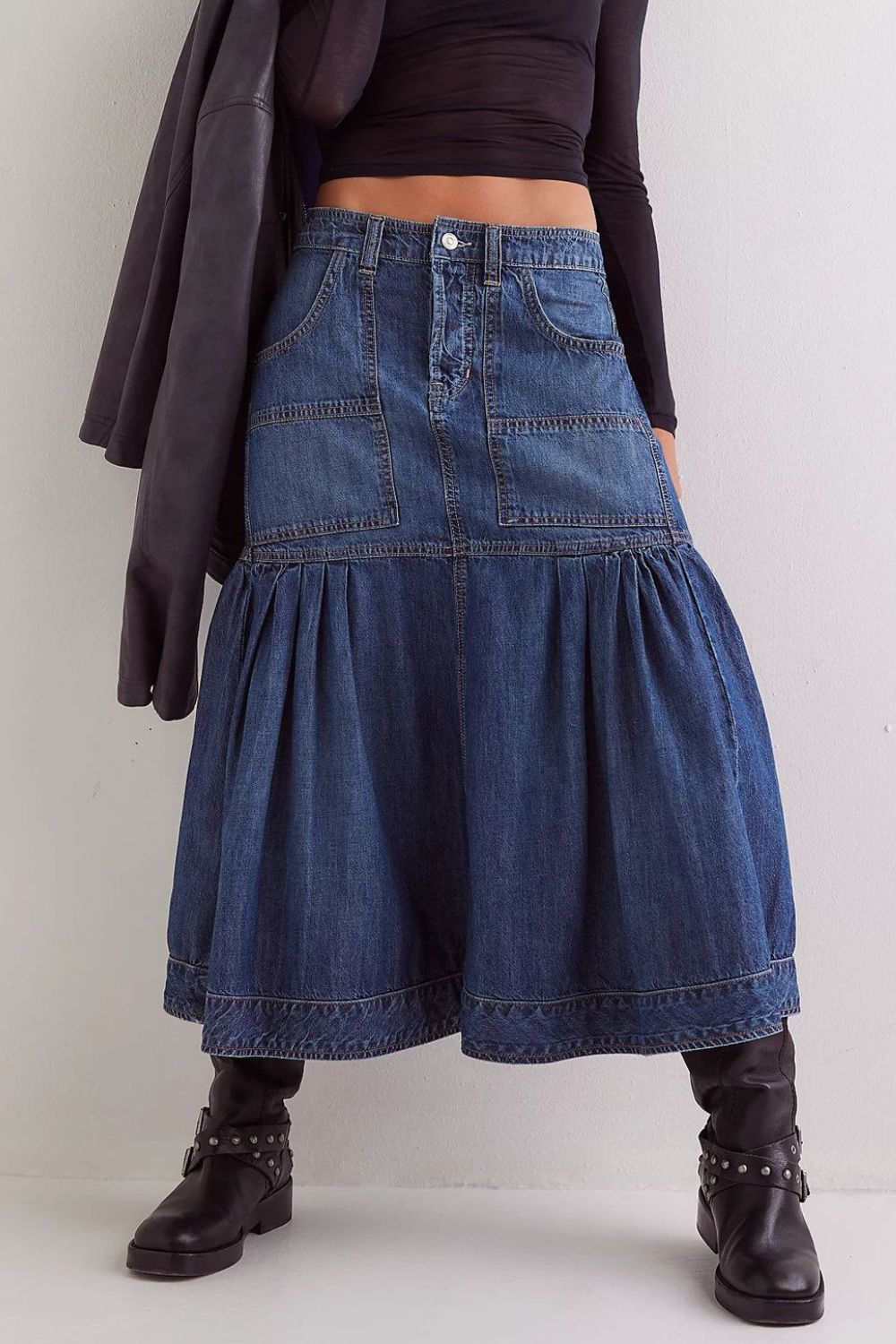 Denim midi skirt in dark wash with flounce hem, patch pockets, and button fly.