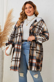 Plaid hooded shacket with balloon sleeves in black, styled open over a white turtleneck and jeans.