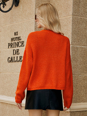 Orange-Red textured button-down knit cardigan with ribbed detail.