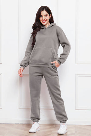 Gray relaxed fit hoodie with front pocket and matching joggers.