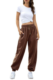 Relaxed-fit cuffed sweatpants in chocolate brown with drawstring waist and pockets.