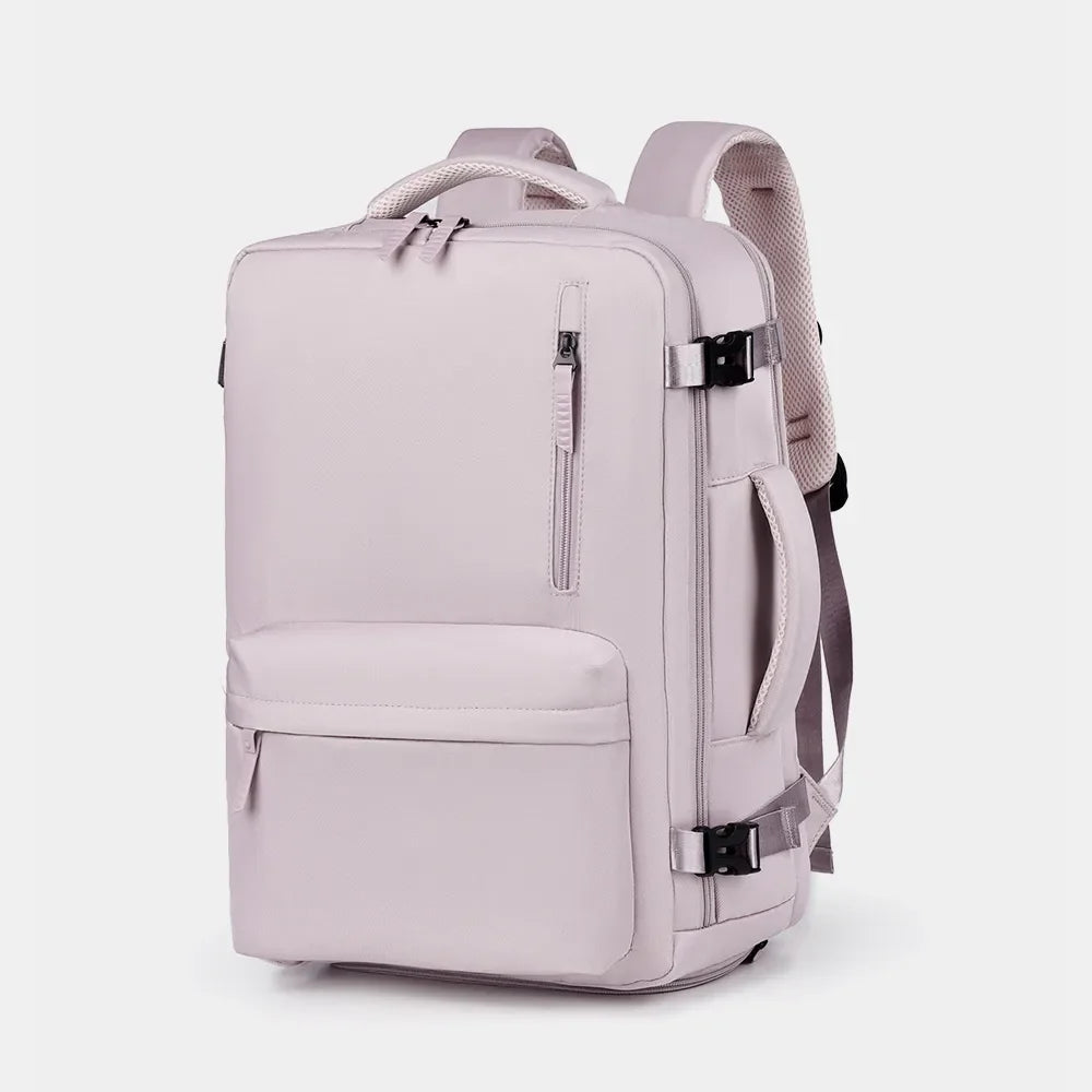 Beige travel backpack with multiple zippered compartments and side handle.