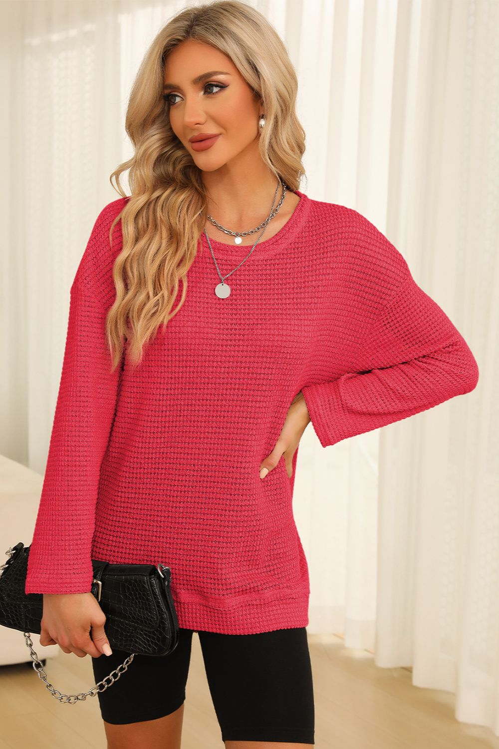 Waffle knit oversized top in strawberry with slit hem and crew neck.