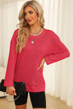 Waffle knit oversized top in strawberry with slit hem and crew neck.