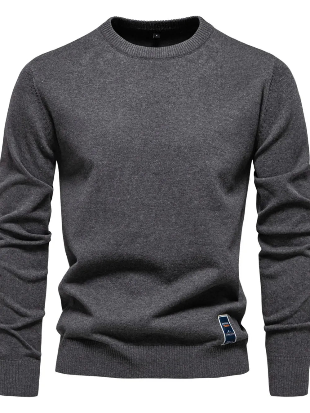 Gray crew neck knit sweater with ribbed cuffs and hem, featuring a small logo patch.
