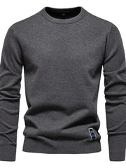 Gray crew neck knit sweater with ribbed cuffs and hem, featuring a small logo patch.