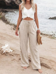 Relaxed beige drawstring wide-leg trousers with decorative side trim.