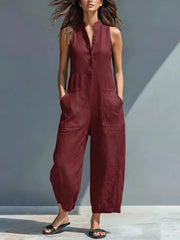 Wine red button-down sleeveless romper with pockets and a collared neckline.