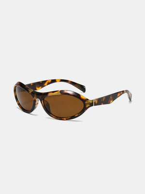 Sculpted oval lens sunglasses in tortoise shell pattern with brown lenses.