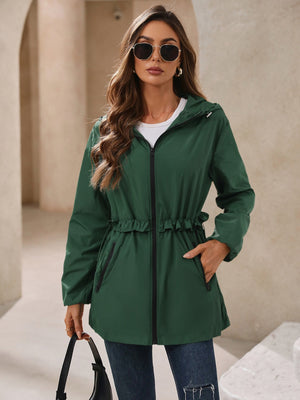 Dark green hooded windbreaker jacket with ruffled waistline and zip pockets.