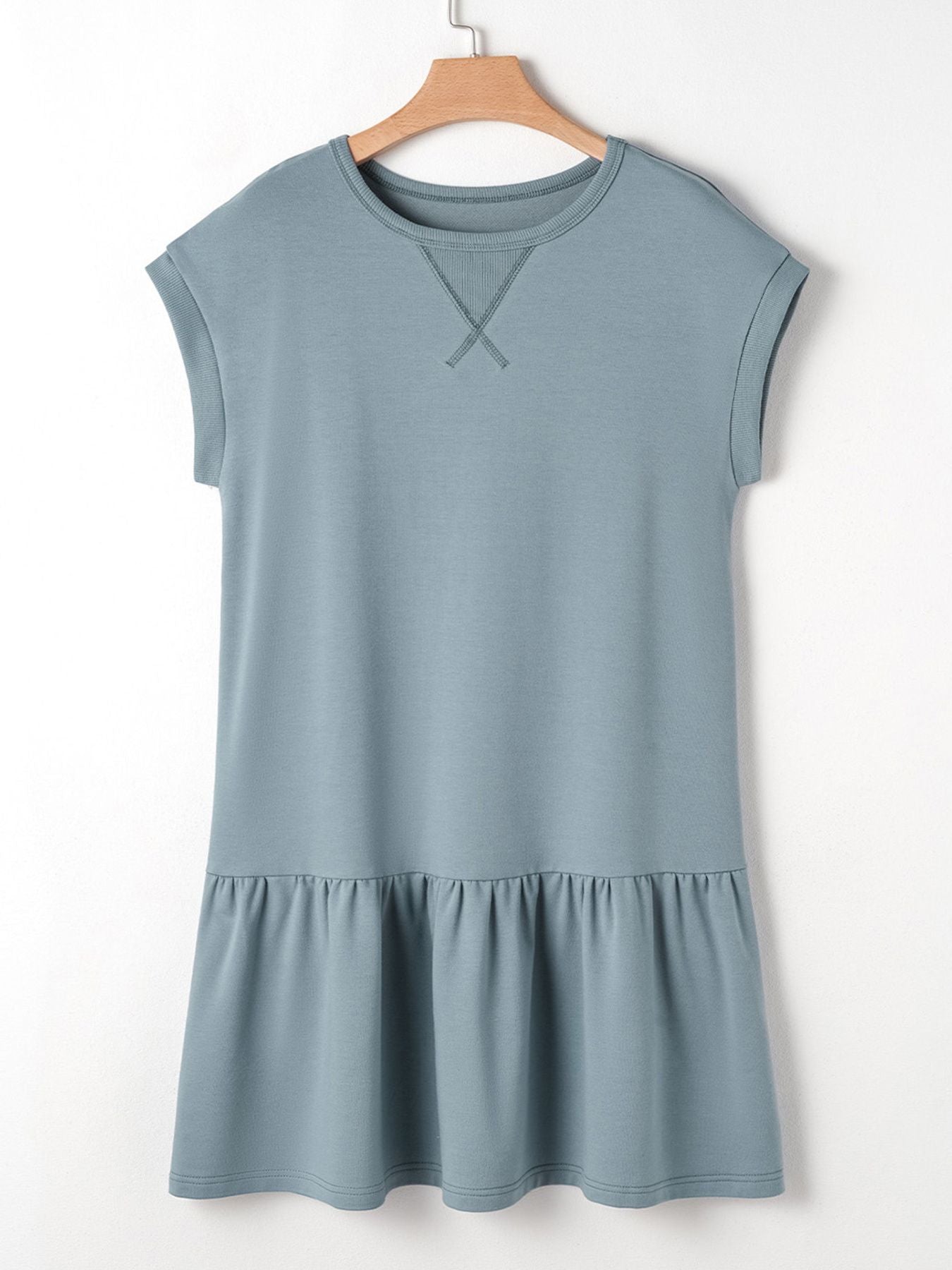 French blue cotton cap sleeve drop waist t-shirt dress with ruffled hem and contrast stitching detail.