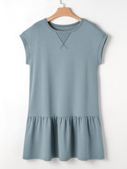 French blue cotton cap sleeve drop waist t-shirt dress with ruffled hem and contrast stitching detail.