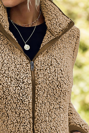 Camel teddy fleece zip-up jacket with a stand-up collar and full zipper.