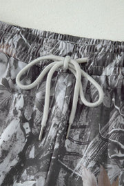 Maple leaf print elastic waist shorts with drawstring detail